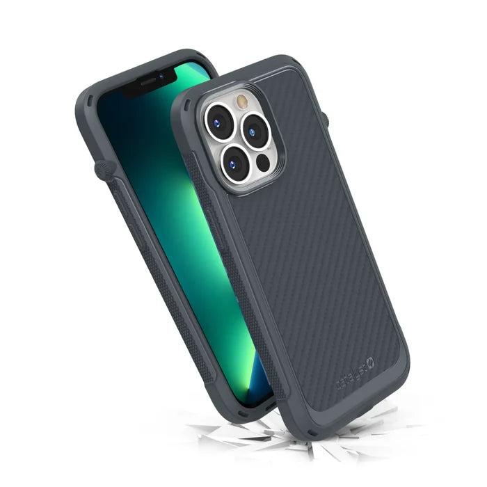 Two Catalyst Case US Vibe Cases in Battleship Gray are shown on iPhone 13 Pro models with glowing screens. One stands upright and the other lies flat, both showcasing MagSafe compatibility and triple camera cutouts. Cracks highlight impact protection.