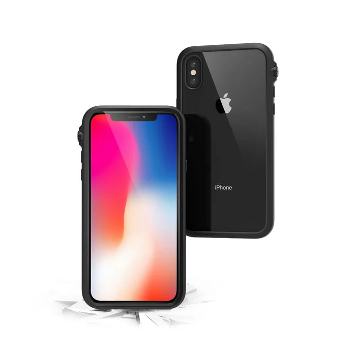 Two black iPhone X / Xs devices with Catalyst Case US Impact Protection Cases are shownÃƒÂ¢Ã¢â€šÂ¬Ã¢â‚¬Âone displays a vibrant screen, the other reveals the Apple logo and dual cameras. Cracks below emphasize drop-proof protection for peace of mind.