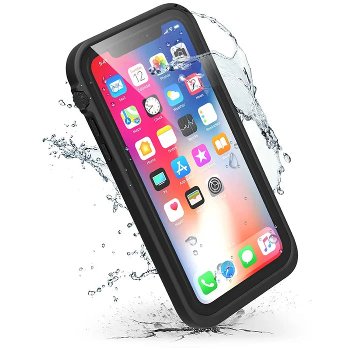 The Catalyst Case US iPhone Xs Max Waterproof Case in Stealth Black is shown with water splashing around it, highlighting its waterproof design. The phone display shows vibrant app icons and notifications, indicating it's on and fully functional.