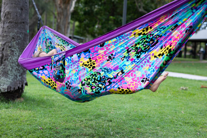 Recycled hammock with purple frame and multicolour geometric print fabric