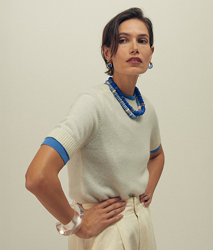 Model wears white sweater with Laguna Necklaces in Sky and Dark Blue.