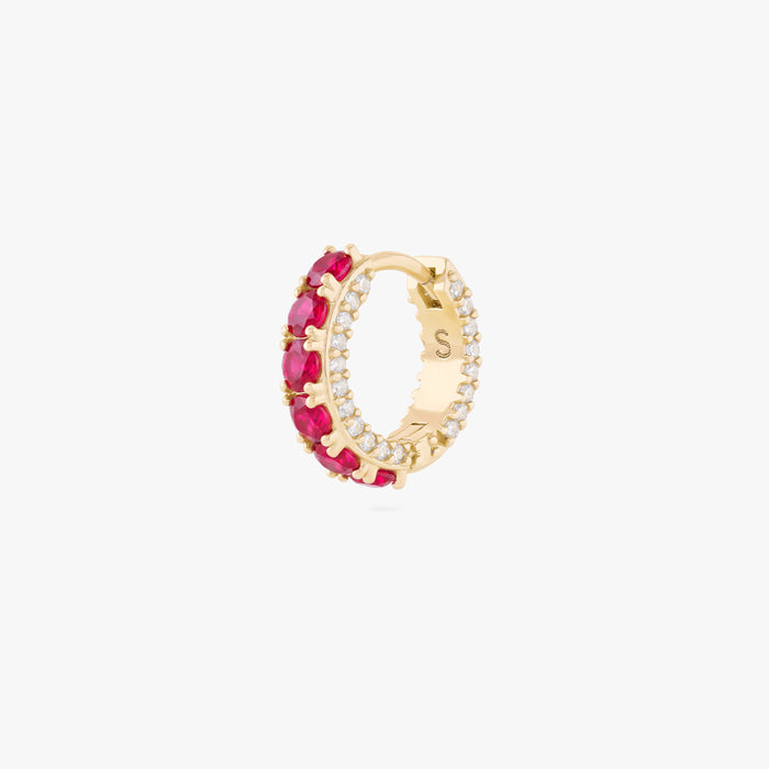 this image shows the side view of the max pave huggie with red cz stones along the front and clear along the side of the huggie
