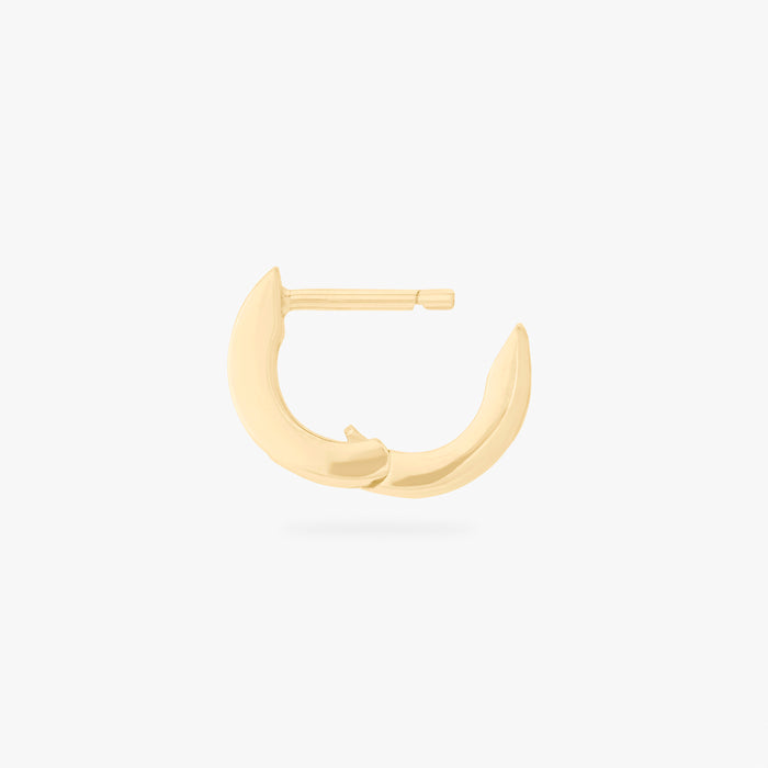 This is an image of a 14K gold plated huggie earring with 4 baguette cut, bezel set crystal CZs along the edge. This image shows the huggie open.