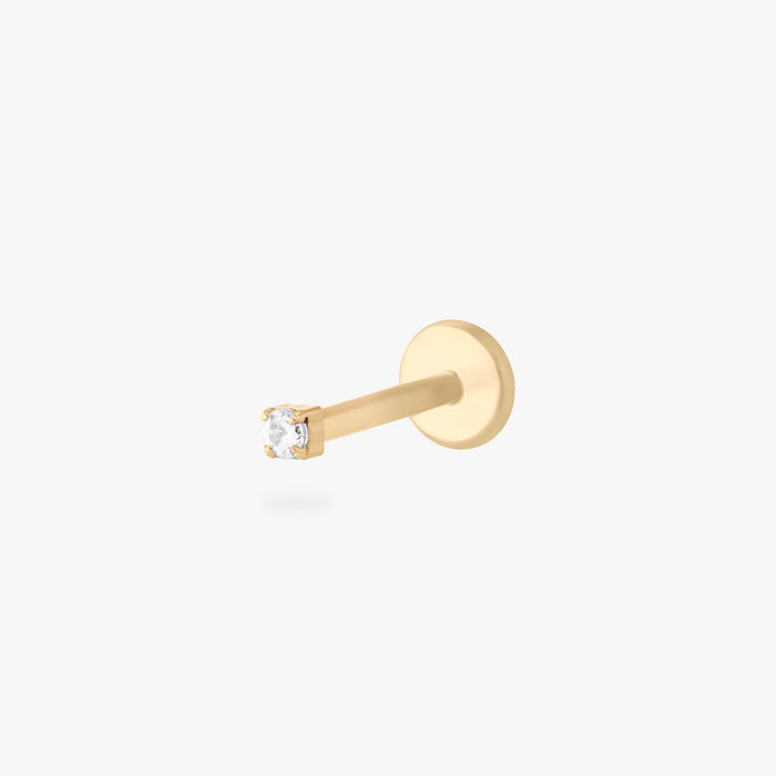 Gold stud flatback earring with a micro clear cz gemstone on a white background