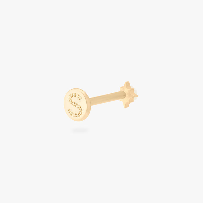 This is an image of a gold-toned flatback stud that is in the shape of a twinkle star with a clear CZ in the middle. color:null|gold/clear