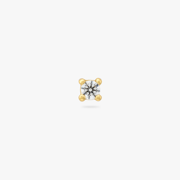 A mini gold stud with a clear cz gem color:null|gold/clear