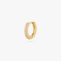 A mini gold huggie lined with clear cz gems on the front color:null|gold/clear