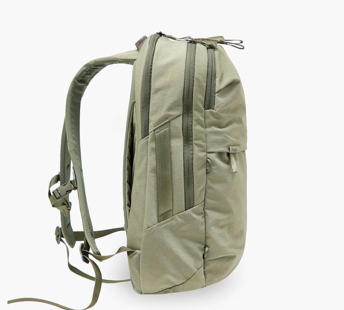 Side profile of MODE Backpack 22L in Cypress showcasing padded shoulder straps and zippered main and front compartments on white background
