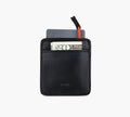 Black leather card wallet holding two cards and a partially visible folded bill