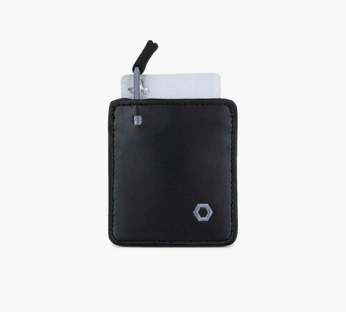 Front of Mojito Wallet in black vegan leather with pull-tab card pocket, partially ejected card, and hexagon logo on white