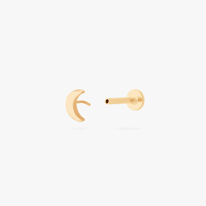 This is an image of a gold moon shaped flatback top with a gold labret with a circle disc with the "S" logo engraved in it. color:null|gold/clear|gold
