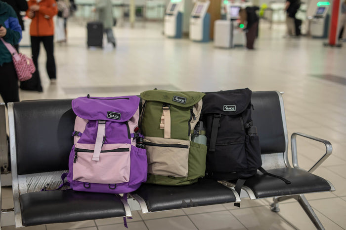 Mulberry purple recycled travel backpack with pink contrast panel