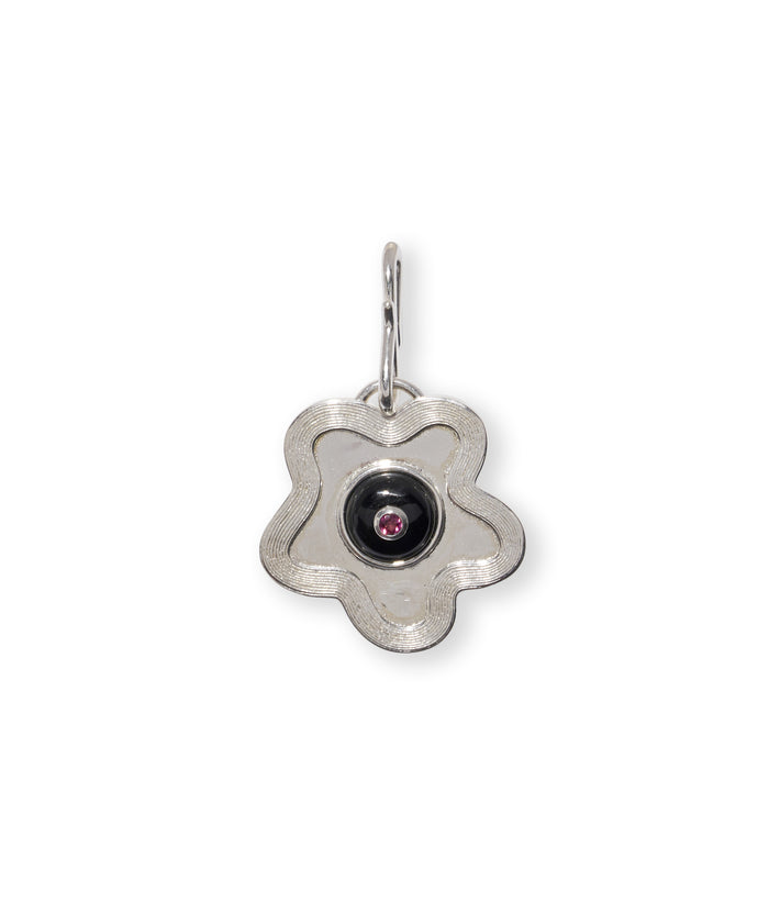 Nana Pendant in Silver. Wavy abstract flower in silver with black agate circle and inlaid rhodolite. S-hook attached.