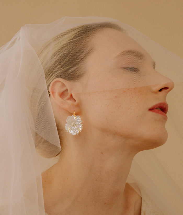 Model wears veil with New Bloom Earrings in Mother-of-Pearl