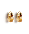 Gold-plated hoop earrings in transparent warm yellow resin.