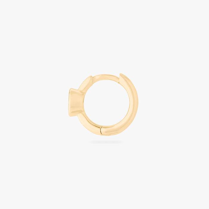 Gold huggie earring side view on a white background