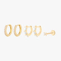 This Pave Starter Set includes two mini pave huggies, two mini pave pear huggies, and one pave x flatback stud. These styles are all gold-toned, and have clear CZ stone accents.