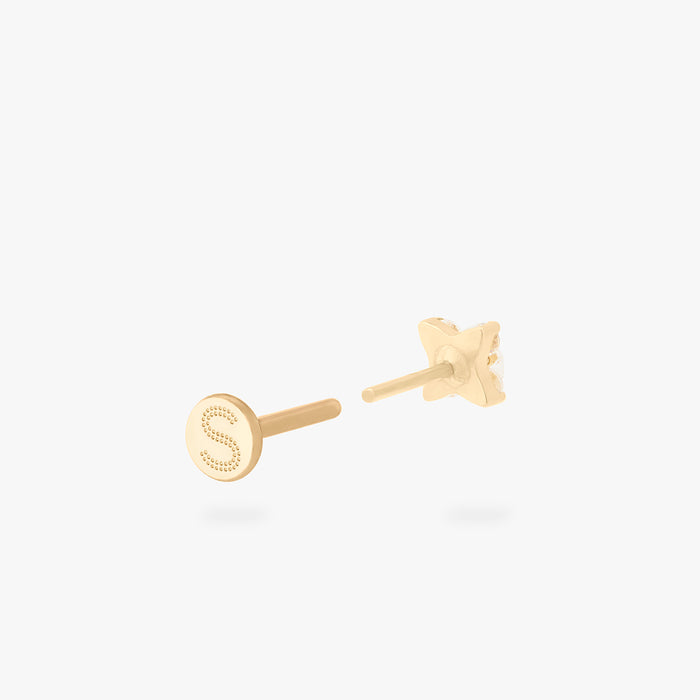 This is an image of a gold-toned flatback stud that has pave cz stones in the shape of an X. color:null|gold/clear