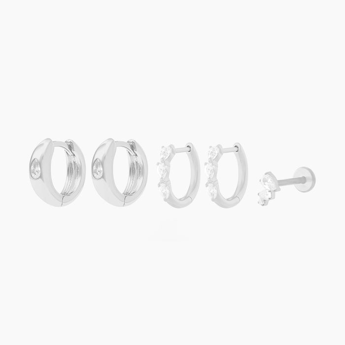 This Pear Starter Set includes 2 mini pave pear huggies, 2 chunky pear cz huggies, and one pear cluster flatback stud. These styles are all silver-toned with clear CZ stone accents.