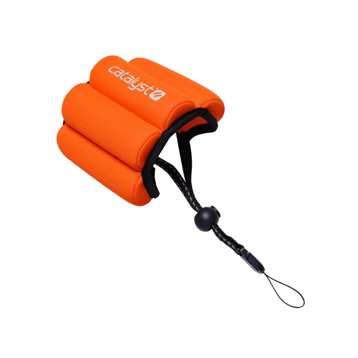 The Catalyst Case US Floating Wrist Lanyard is a bright orange foam strap with three curved sections, a black adjustable cord and toggle, and features the white ÃƒÂ¢Ã¢â€šÂ¬Ã…â€œcatalystÃƒÂ¢Ã¢â€šÂ¬Ã‚Â logo. ItÃƒÂ¢Ã¢â€šÂ¬Ã¢â€žÂ¢s designed to keep your devices afloat in water.