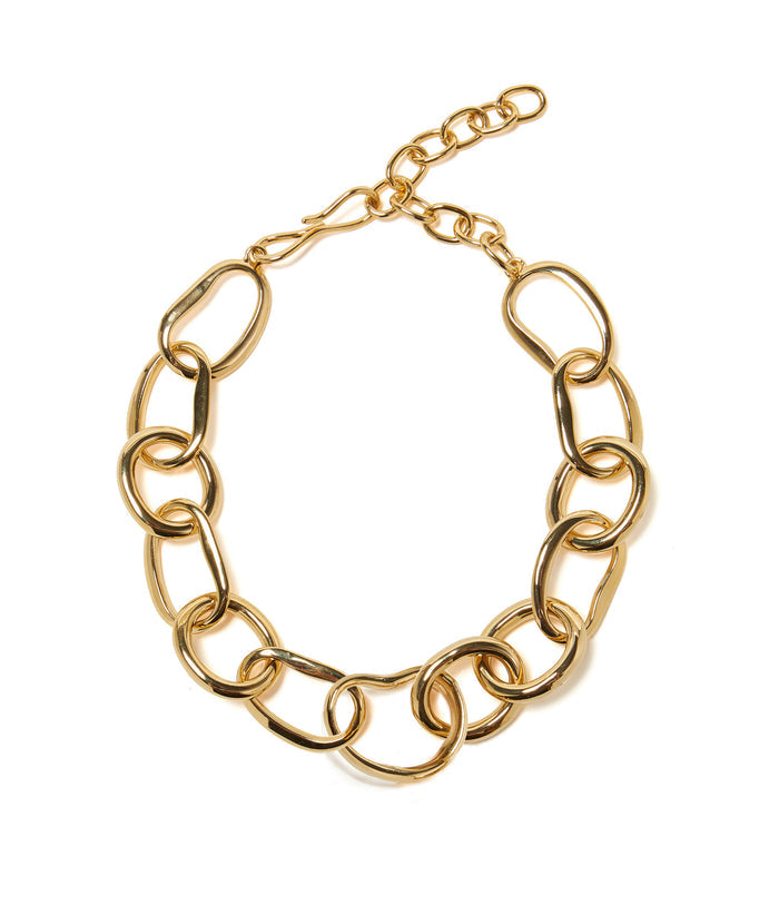 Porto Chain features oversized abstract links in gold-plated brass in a white background.