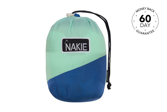 Mint and navy colorblock recycled hammock with black drawstring straps and NAKIE patch label.