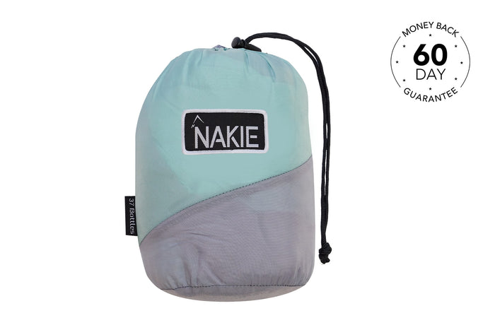 Light blue and gray recycled nylon hammock with black NAKIE branding label and drawstring closure, front view.