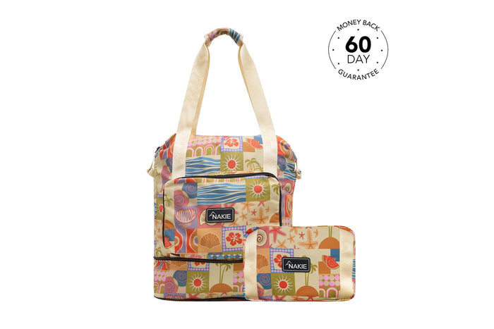 Multicolored beach-print recycled tote bag and matching pouch with cream canvas handles and NAKIE branding.