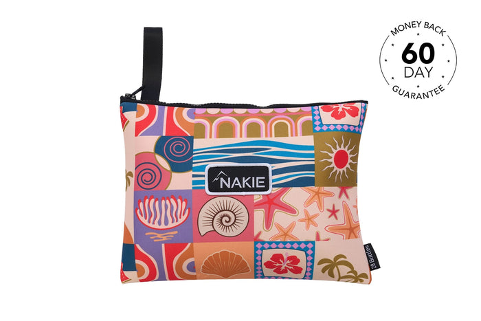 Retro Shores beach towel with colorful patchwork print featuring shells, starfish, and tropical motifs