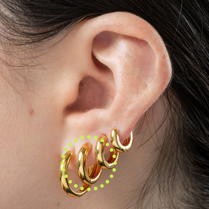 A small bulky and chunky shaped gold huggie [hover] color:gold