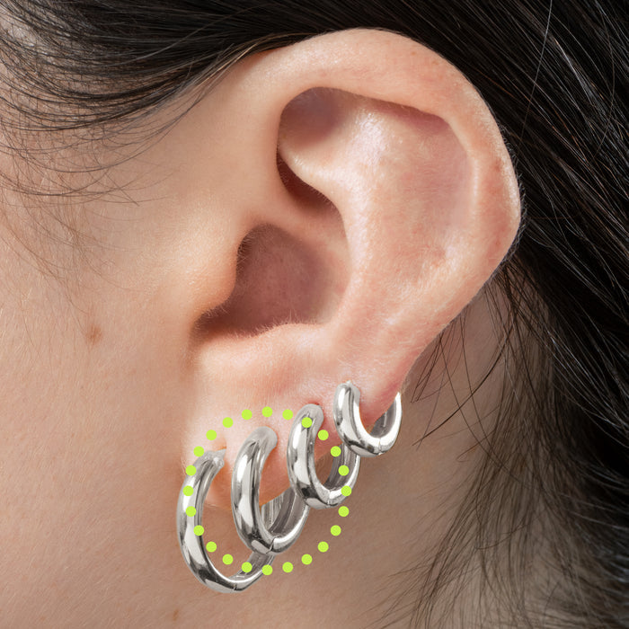 A small bulky and chunky shaped silver huggie [hover] color:null|silver