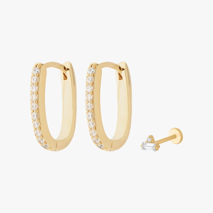 Gold earscape featuring a pair of Pave Oval Hoops and a micro stacked baguette flatback stud with clear stones