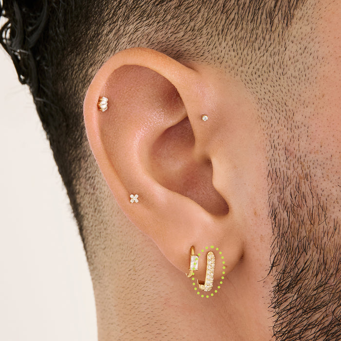 This is an image of a gold-toned, square-shaped huggie with pave CZ stones on ear. [hover] color:null|gold/clear