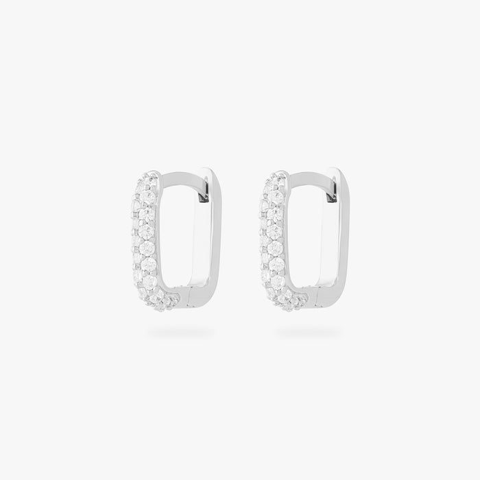 This is an image of a pair of silver-toned, square-shaped huggies with pave CZ stones. [pair] color:null|silver/clear