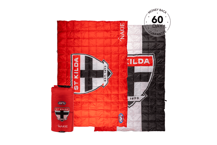 Red quilted down blanket with St Kilda Saints logo and crest, shown folded with carrying bag and displayed alongside striped