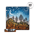 Recycled picnic blanket with starry night forest design in blue, gold, and black, shown rolled with carrying strap.