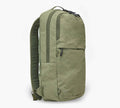Three-quarter front view of Stash Packable Backpack 16L showcasing cypress recycled nylon and front zip pocket on white background