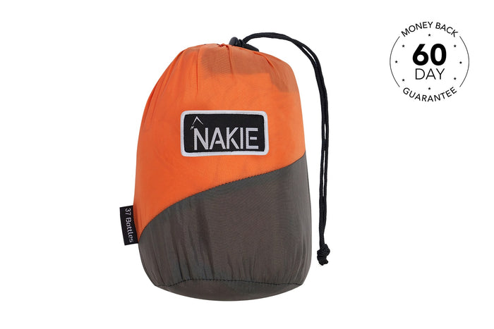 Orange and charcoal recycled hammock with black drawstring straps and NAKIE logo patch