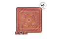 Rolled terracotta picnic blanket with pink and gold floral pattern, sun motif center, displaying product branding.